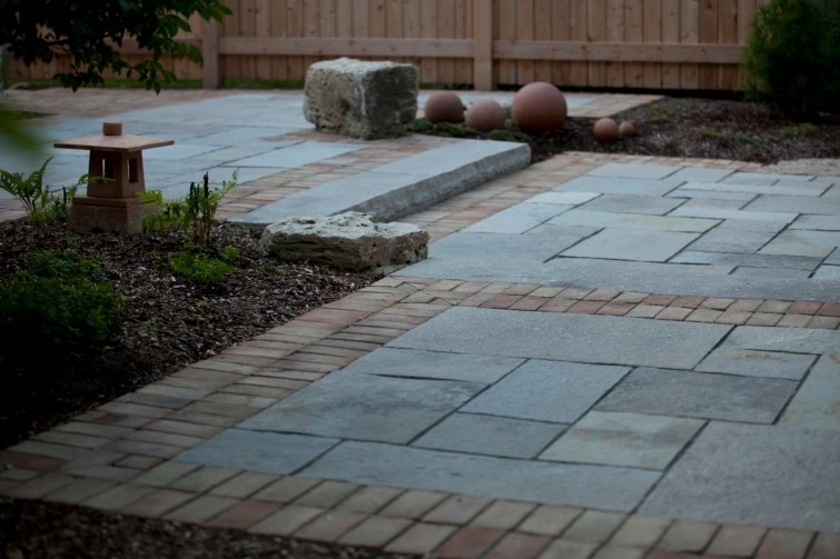 Limestone patio with brick border