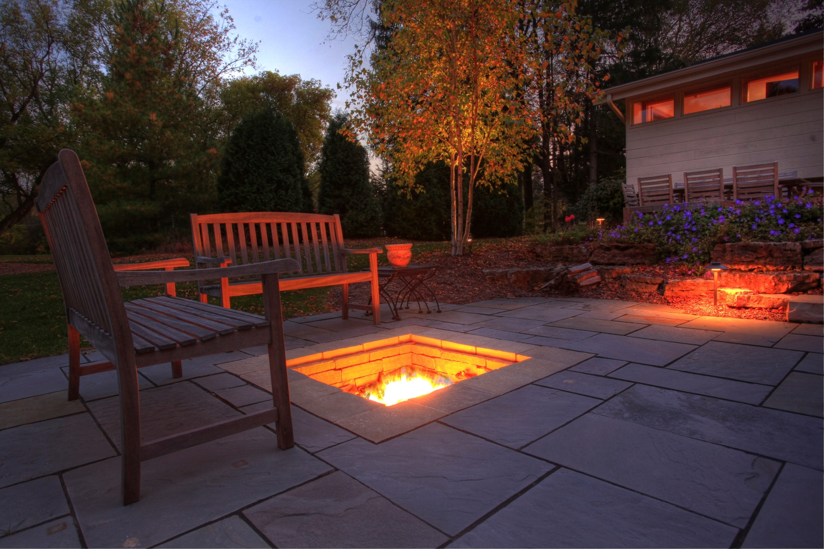 Fire pit and lighting at dusk