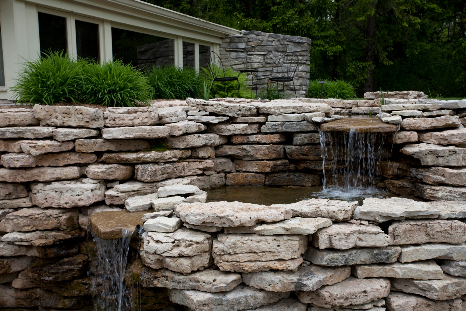 A recirculating water feature is included in this retaining wall in Mequon, WI.