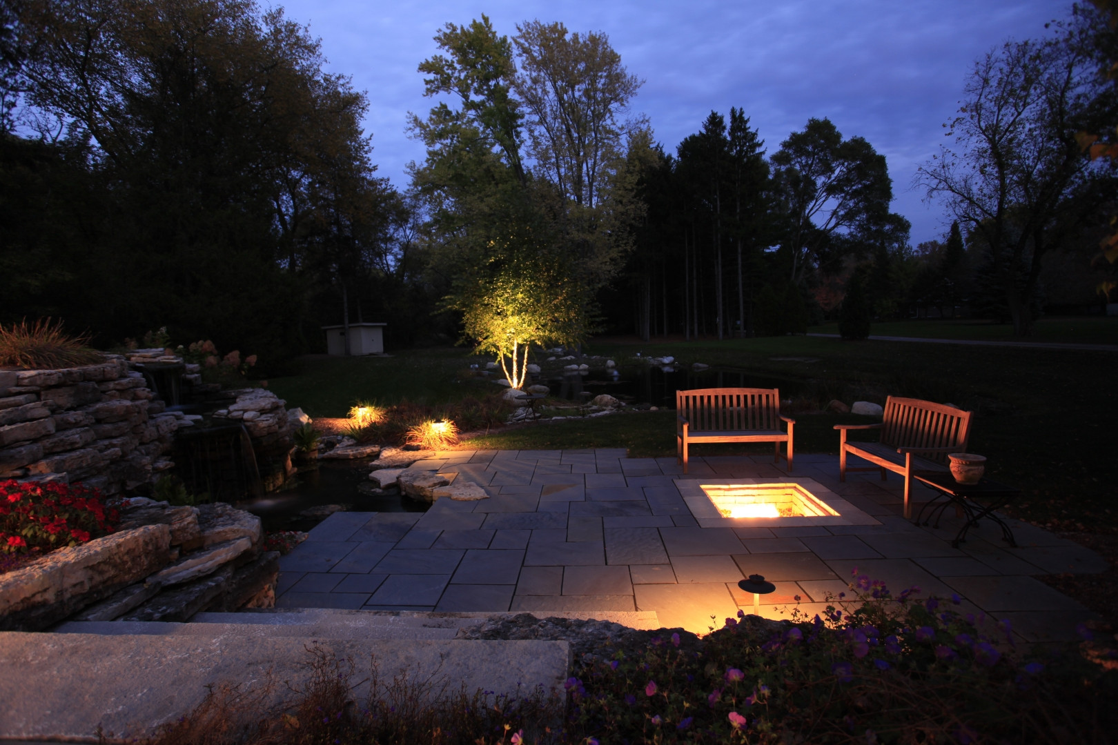 This landscape in Mequon, WI includes landscape lighting.